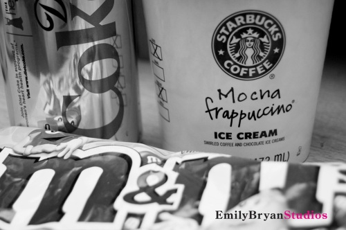 Can of Diet Coke, carton of Starbucks Mocha Frappuccino ice cream, and a bag of Peanut M&M's