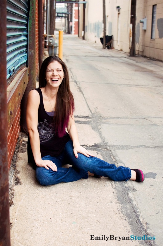 Carrie Yale in Manhattan, KS laughing in an alley